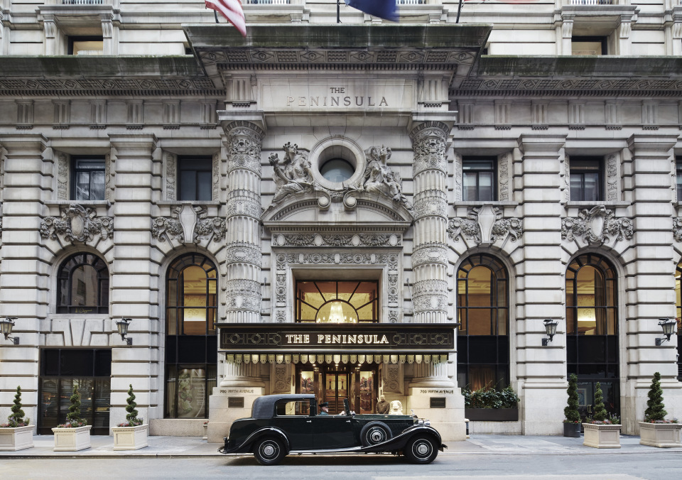 High-resolution project photo showing a classic luxury car positioned in front of The Peninsula hotel facade